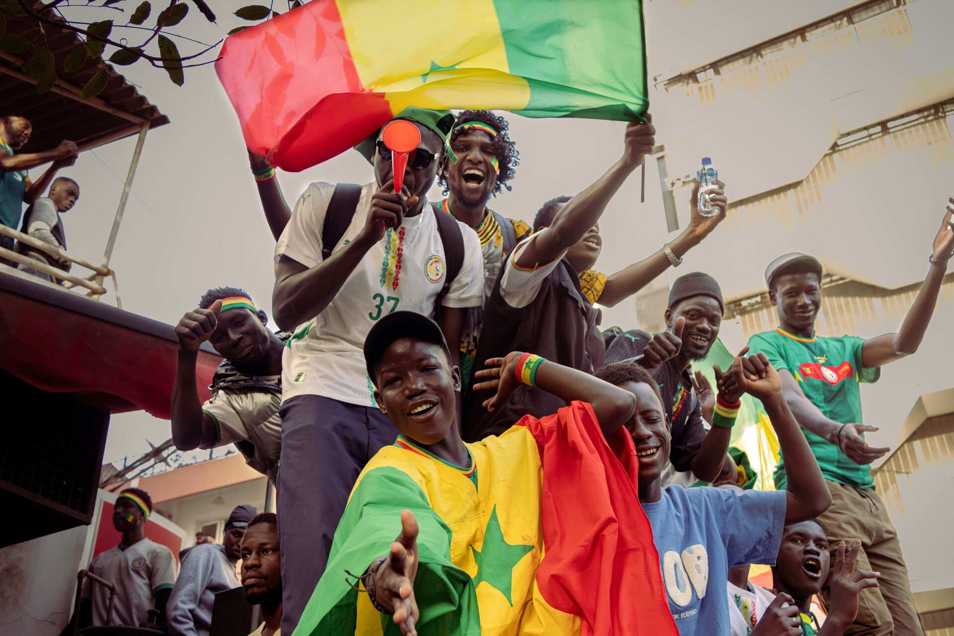 Senegal and people celebrating with Flags of Senegal